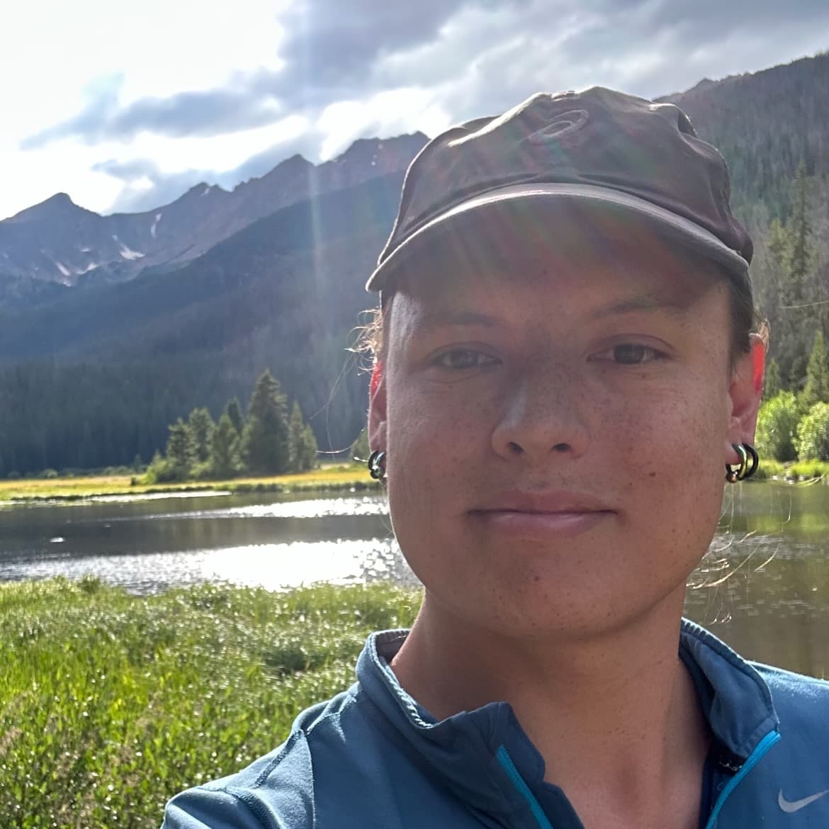 Michelle Hadfield in front of a mountain lake